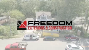 Freedom Exteriors Logo Overlay over House in Distance