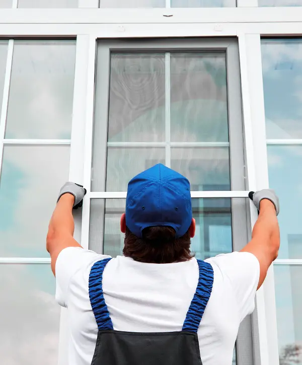 Worker Replacing Windows In Madison City Alabama