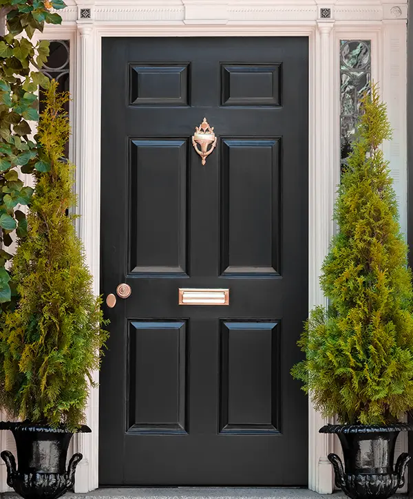 Black Front Door with White Door Frame and Greenery - Madison AL